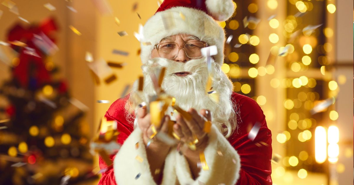 Fotografija Deda Mraza koji razbacuje zlatne konfete