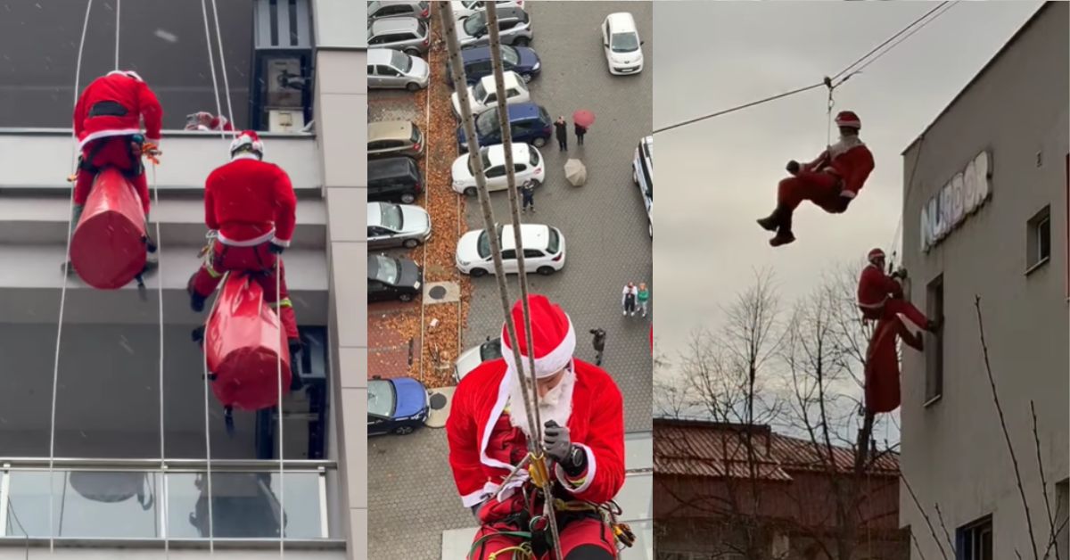 Pripadnici Gorske službe spašavanja se penju na zidove bolnice obučenui u Deda Mrazove
