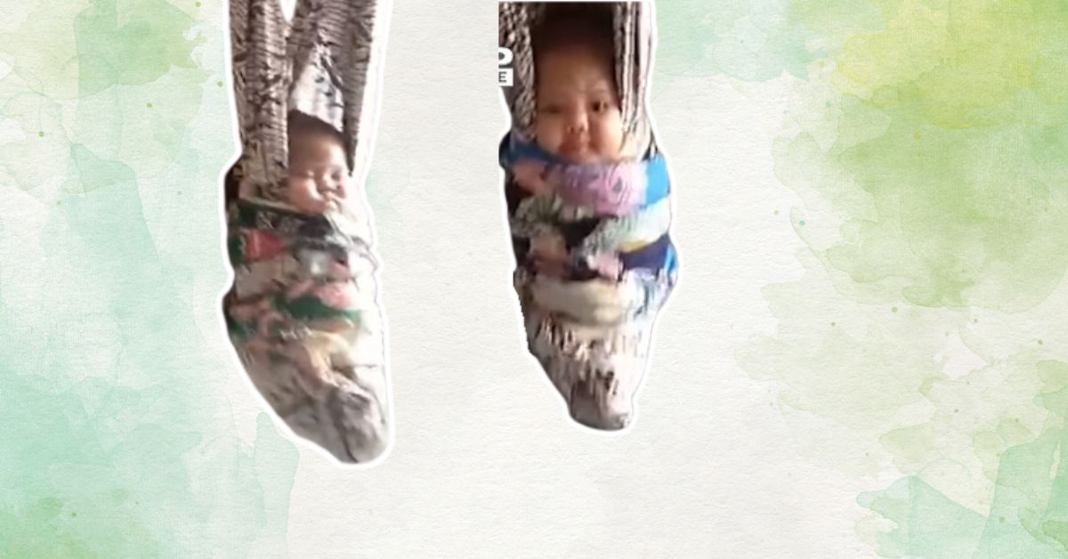 Dve bebe vise uspravno u ljuljaškama